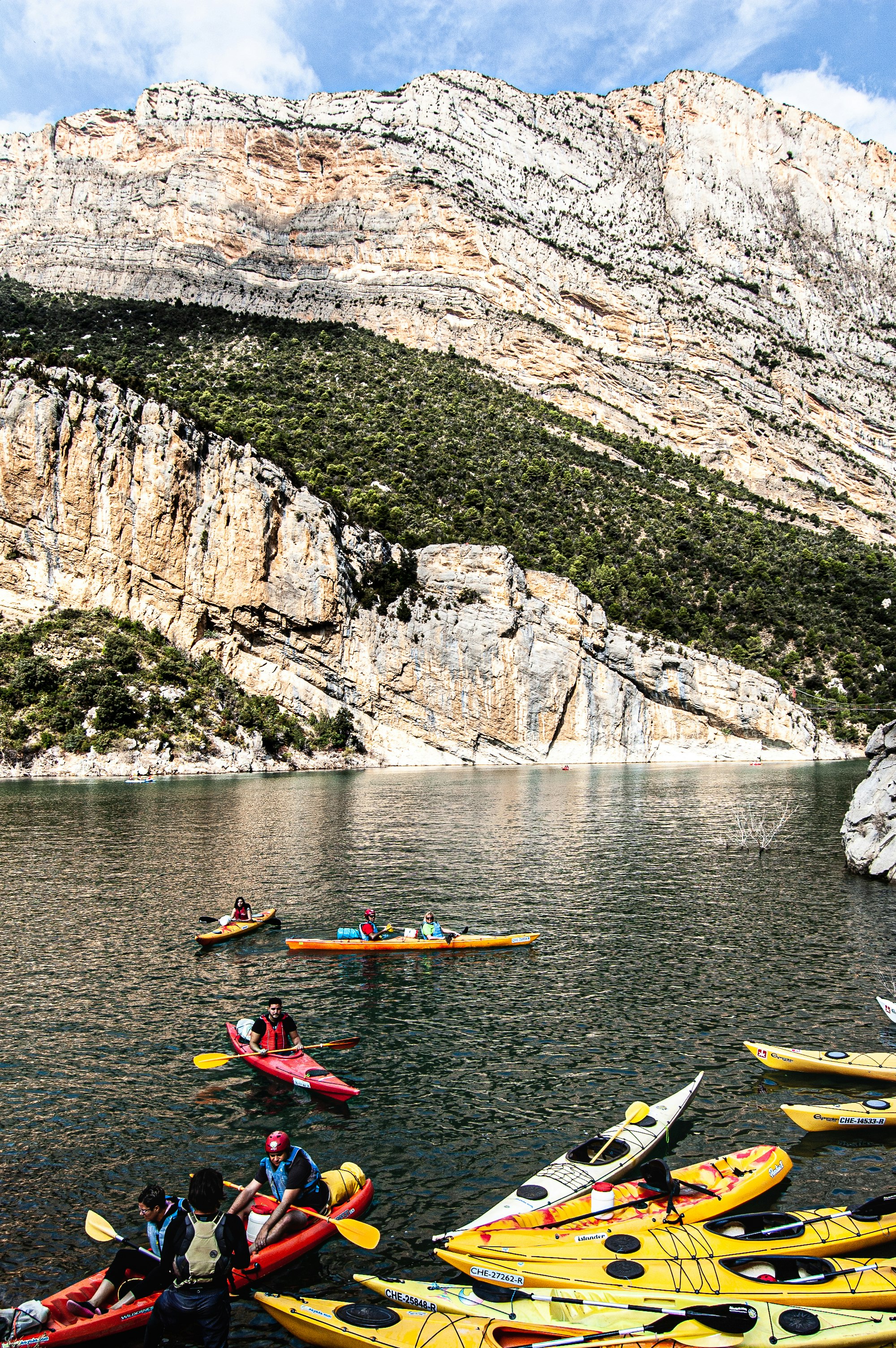 person riding on kayak on river during daytime